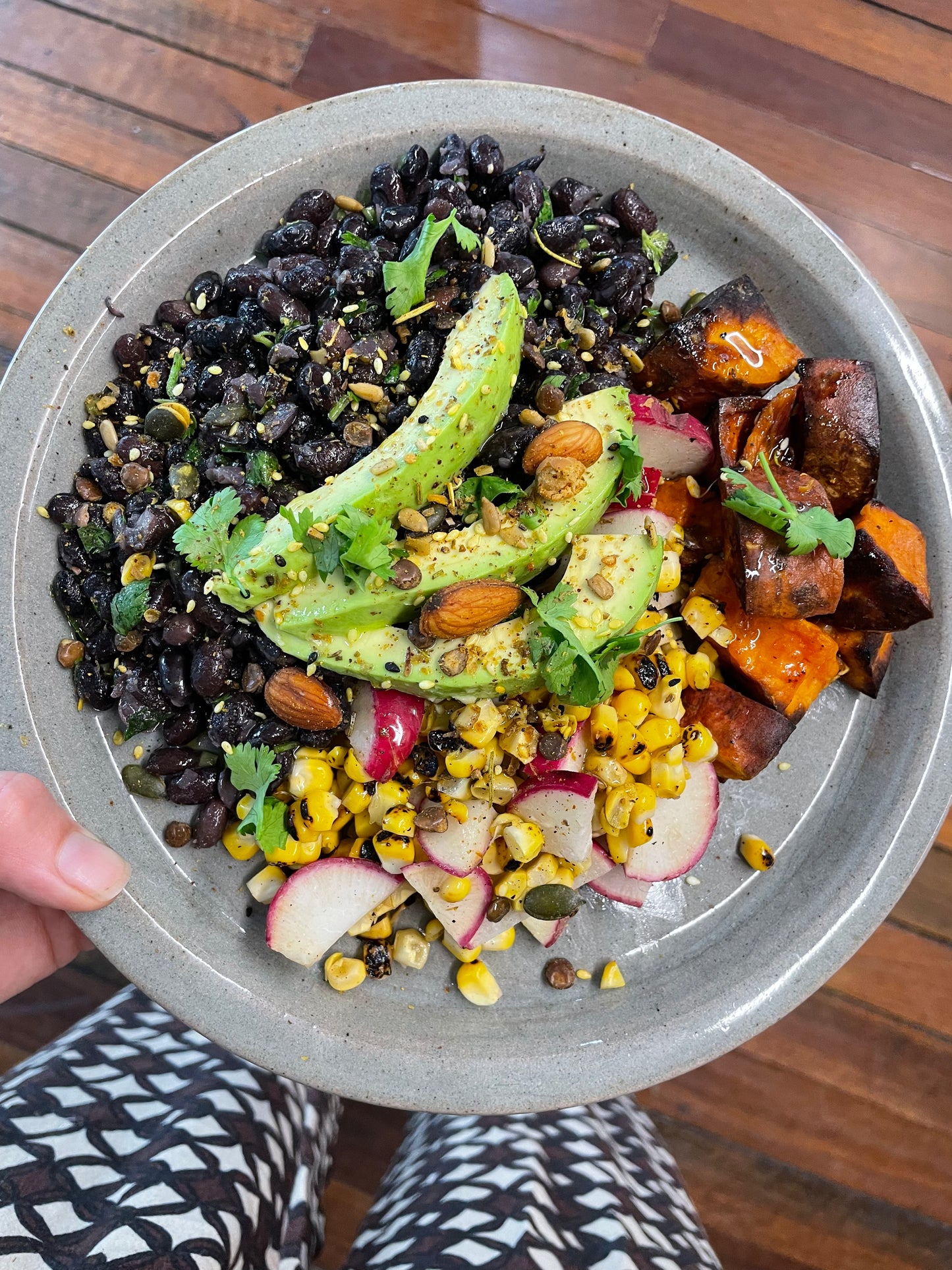 SPICED BLACK BEANS WITH ROASTED SWEET POTATO, CHARRED CORN, KALE, RADISH + CORIANDER SALAD