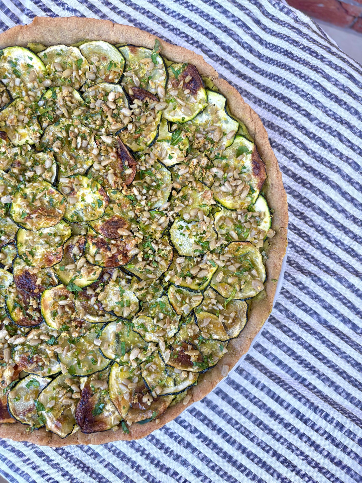 ZESTY ZUCCHINI, WHITE BEAN + HERB  GRATIN TART