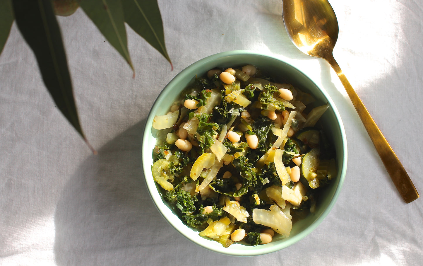GREENS, BEANS, HERBS + LEMON SOUP